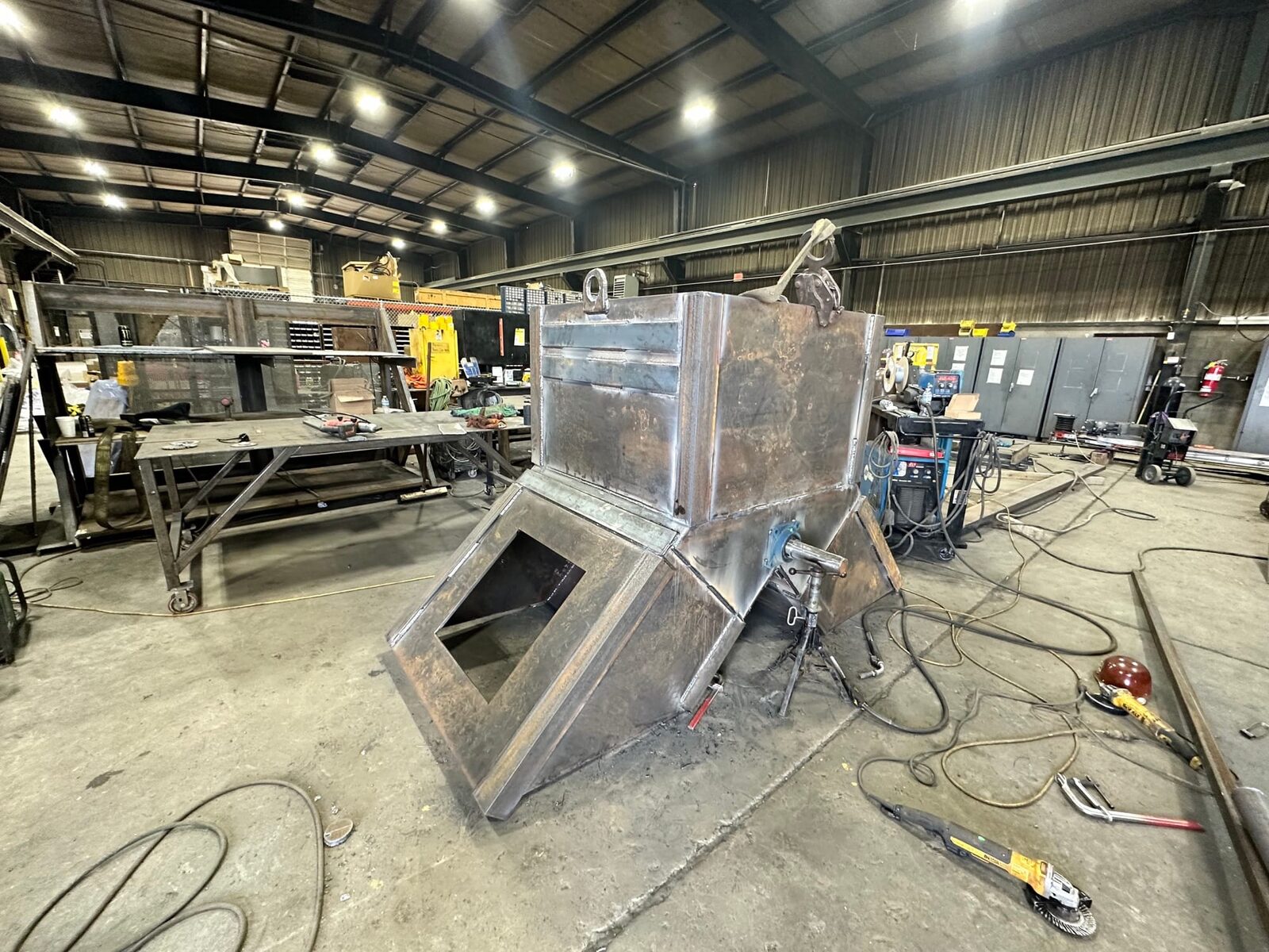 Topside fabrication of new heavy-gauge steel mine chutes and shaft supports, detail